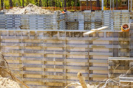Formwork construction concept unfinished house with metal formwork holders