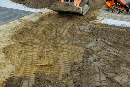 Construction bulldozer leveling and moving soil landscaping works on the earthmoving