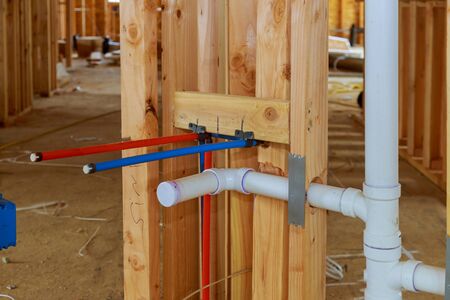 New residential construction house framing a plumbing in the laundry room on beam framing