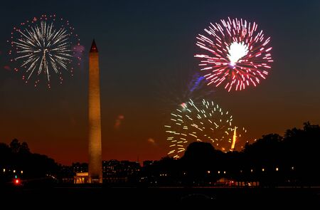 American patriotic US holiday Fireworks display on 4th July Independence Day in the Washington Monument in Washington DCの写真素材