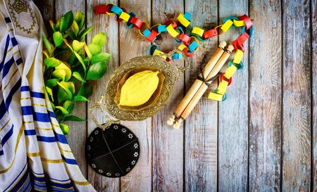 Jewish ritual festival of Sukkot in the jewish religious symbol Etrog, lulav, hadas arava kippah and shofar tallit praying bookの写真素材