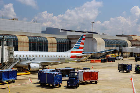 10 JUN 20 Charlotte, NC US: American Airlines plane on the airport airlines wing with American flag...