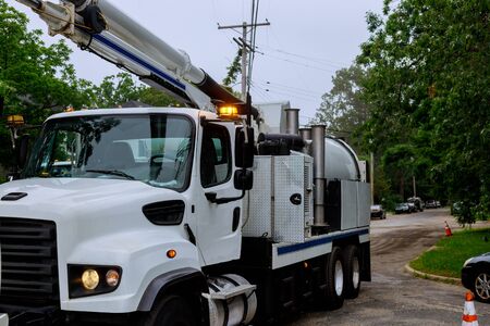Sewage industrial cleaning truck clean blockage in a sewer line machine from the inside.の写真素材
