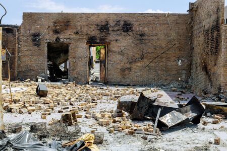 Burned abandoned burned dark walls with dust selective focus in the USA burns violent of a burnt by fire buildingの写真素材