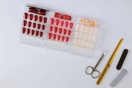 Several palette of nail designs of different colors on a light background.の写真素材