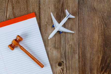 Office legislation law traveler with blank paper notes judge's gavel travel model plane airplane