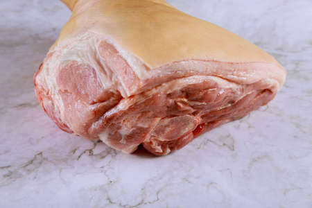 Fine meat pork leg on a butchery in marble boardの写真素材