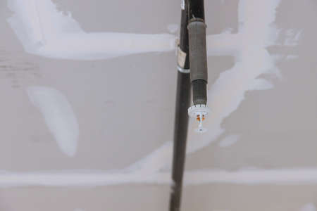 Close up automatic fire sprinkler fire on the ceiling in office building