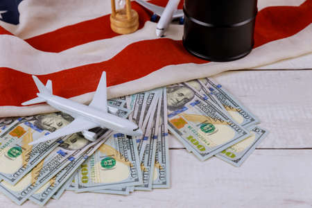 Rising world oil prices brand USA flag model airplane oil barrels on US dollar oil business