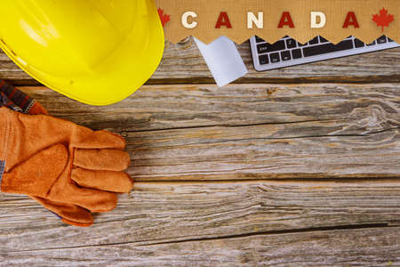 Happy celebrate Canadian Labor Day a digital tablet yellow helmet with symbol patriotismの写真素材