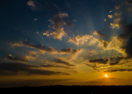 Colorful dramatic sunset sky bright horizon burning skies with clouds