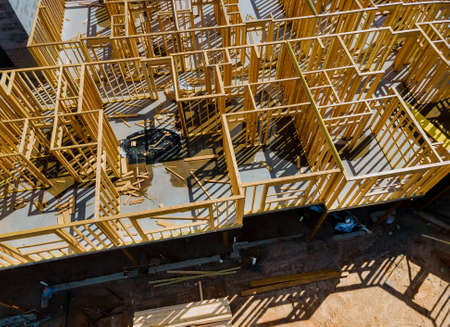 Framing of under construction beams house on of new home constructionの写真素材