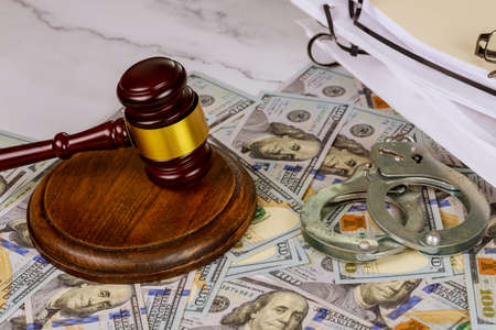 Judge's gavel with the United States flag legislation and law judge police handcuffsの写真素材