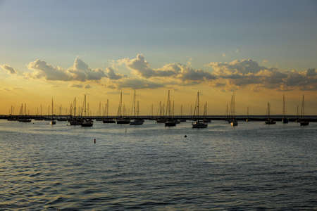 Beautiful boats aerial view of colorful boats in to ocean bay with against sunset.の写真素材