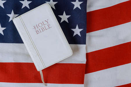 Holy Bible with on a religious book on American flagの写真素材
