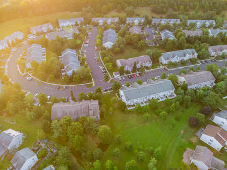 Aerial view at sunset the roofs of houses in the small town of America NJ at sunsetの写真素材