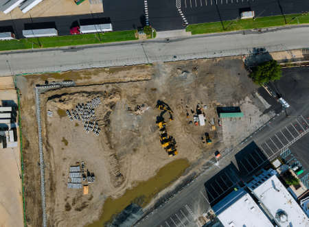 House construction work of view of small construction site with many trucks machinery of new...