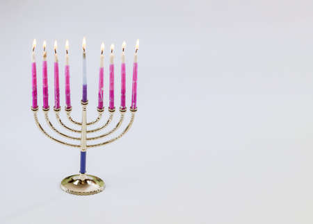 Jewish Holiday symbol Hanukkah menorah in the orthodox Jew Festival on white isolate backgroundの写真素材