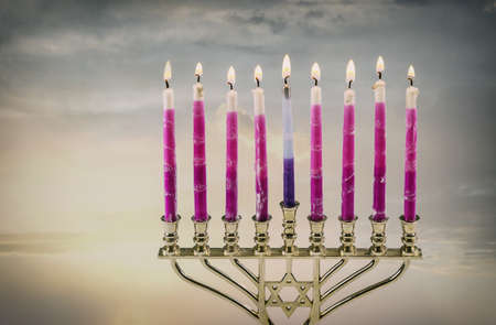 Jewish Holiday symbol with burning candles Hanukkah menorah in the orthodox Jew Festivalの写真素材