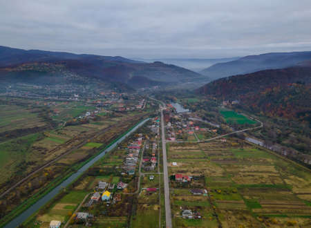 Aerial top dow view over suburb area village near mountain high altitude aerial top down view over countryside of Karpatyの写真素材