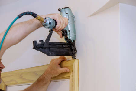 Process for installing in the framing trim nailing to moldings on doorsの写真素材