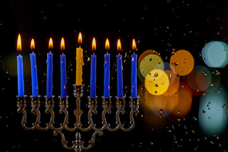 Jewish Religion holiday symbol for Hanukkah in hanukkiah Menorah with burned candles with bokeh