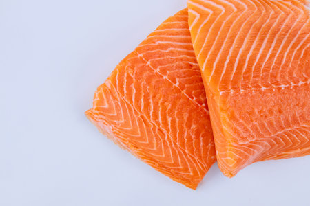 Two fresh raw salmon fillet with on a isolated white background