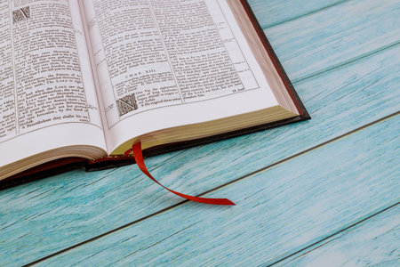 Desk table opened the Holy Bible close up prayer time
