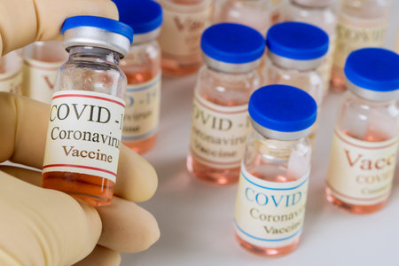 Coronavirus vaccine Sars-Cov-2 close up view of vaccine bottles for injection to fight the pandemic.