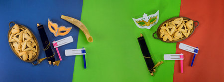 Top view from above Jewish carnival Purim celebration on hamantaschen kosher cookies carnival noisemaker and maskの写真素材