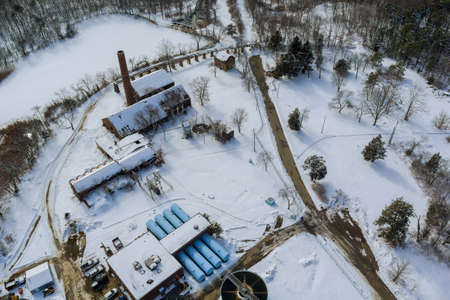 Aerial view of modern little industrial sewage treatment plant at work in the winter season