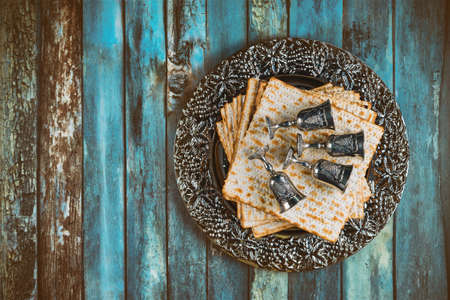 Orthodox Jewish prepared with four cup wine kosher matzah on traditional jewish passover holiday