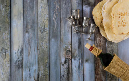 Passover holiday traditional celebration with four cup wine kosher matzah unleavened bread on of Jewish Pesachの写真素材