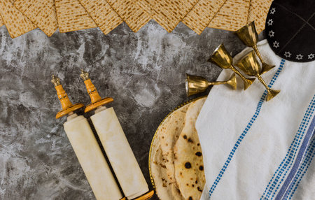 Passover day traditional celebration with four cup for wine and kosher matzah unleavened bread on...