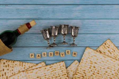 Matzoh jewish holiday red kosher glasses wine with a of matzah a Passover Haggadah
