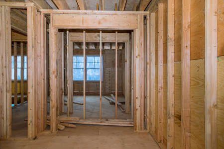 Wooden frame structure house building on a new development framing of under constructionの写真素材