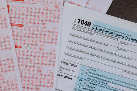 USA tax accounting office paperwork on 1040 form financial time tax form with payment taxes of government lotteryの写真素材