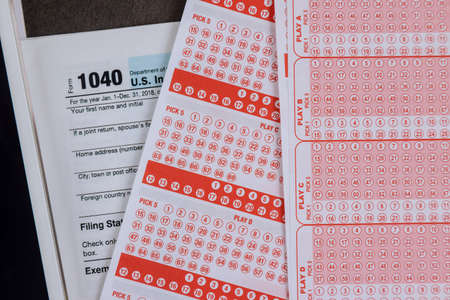 Financial tax accounting payment taxes of win government lottery with pay tax day on application 1040 formの写真素材