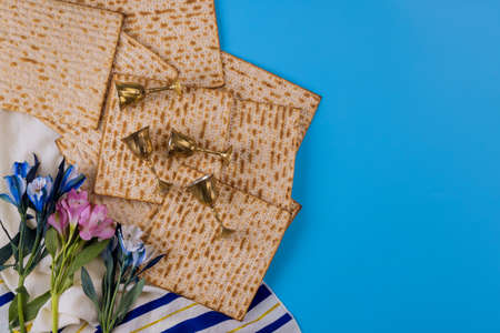 Passover holiday traditional celebration with four cup wine kosher matzah unleavened bread on of...