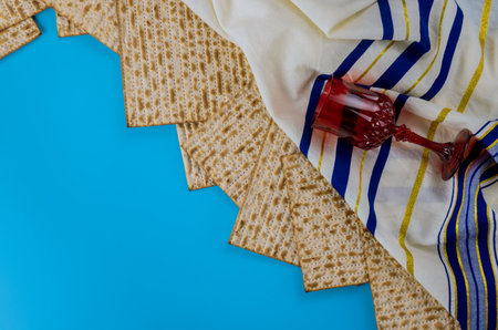 Pesach Jewish traditional celebration with cup wine kosher matzah on passover holiday