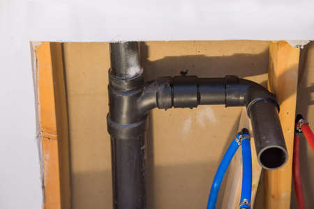 PVC pipe connections assemble and install water and drain under bathroom