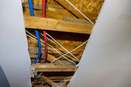 Repair of plastic polypropylene water pipes in hole ceiling in home bathroom