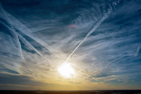 Gorgeous panorama with lining cloud on the orange sky scenic of the strong sunriseの写真素材