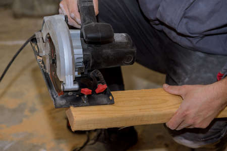 Circular saw carpenter using for wood beam