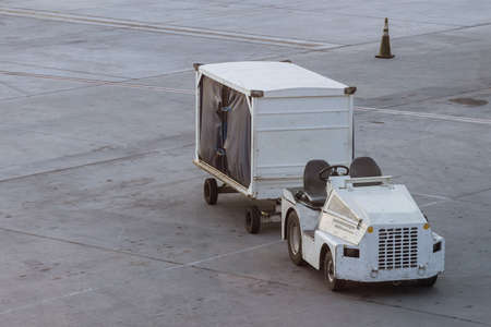 Vehicle for cargo on wait for transport to airplane at airportの写真素材