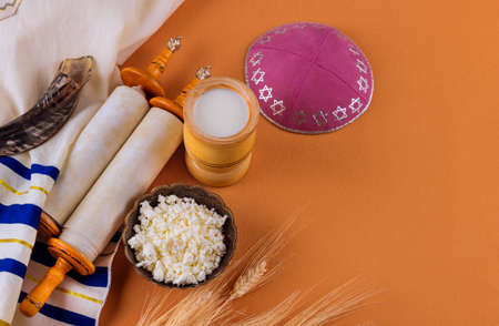 Torah and kippah on celebration traditional Jewish Holiday Shavuot for Kosher dairy product