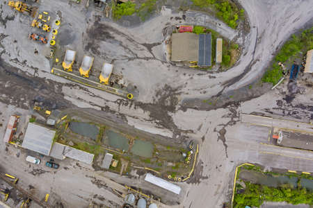 Panorama aerial view quarrying extractive industry big mining of machinery trucks open pit mine...