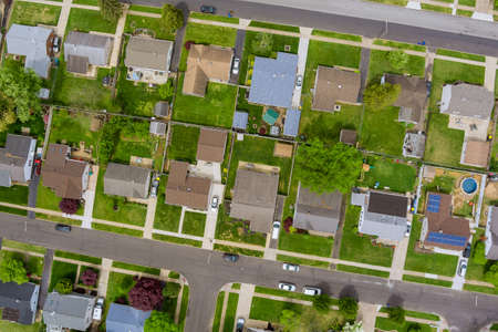 Panoramic view of a neighborhood in roofs of houses of residential area summer housesの写真素材