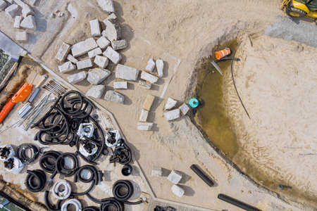 The drainage pipes system of laying underground utilities from black PVC sewer pipes of supply sewageの写真素材