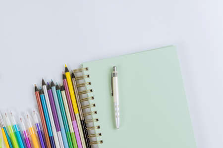 School times in assortment of various school supplies items on stationery equipmentの写真素材